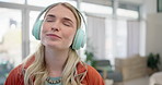 Music, smile and relax with woman on sofa for streaming, happy and energy. Freedom, media and online radio with person listening to headphones in living room at home for technology, sound and audio