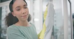 Housekeeping, products and woman cleaning the window with detergent, cloth and gloves for dirt. Female maid, cleaner or housewife wipe the glass door for germs, dust or bacteria in an apartment.