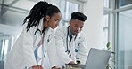 Computer, planning and team of doctors in an office in the hospital for a diagnosis treatment. Healthcare, discussion and young African medical workers doing research on a computer in medicare clinic