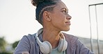 Outdoor, exercise and woman with fitness, thinking and workout goals with wellness, lens flare and training. Breathe, person and athlete outside, relax and headphones with sunshine, calm and peace