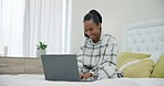 Smile, bed and a black woman with a laptop for remote work, email check or a movie. Happy, house and an African girl or entrepreneur typing on a computer in the bedroom for communication or the web