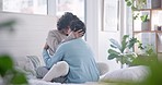 Hug, home bed and couple kiss with love, care and support in a bedroom with relax and bonding. Embrace, happy young people and smile in a house with a woman and man together with romance in morning