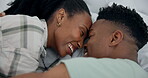 Happy, care and a black couple in bed with conversation, communication and bonding together. Smile, house and an African man and woman with love, speaking and relax in a bedroom on a honeymoon