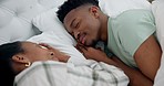 Love, relax and black couple sleeping in bed on weekend morning in their modern apartment. Rest, tired and young African man and woman taking a nap and dreaming together in the bedroom at their home.