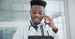 Tablet, phone call and a doctor black man in the clinic for research or innovation in modern treatment. Medical, healthcare and information with a happy medicine professional talking in a hospital