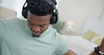 Black man, headphones and dance to music, audio streaming with stress relief and relax at home. Listening to radio, technology and subscription, energy and entertainment, lounge on couch with app