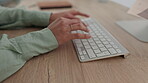 Search, computer and hands of business person in office for planning, website and email. Communication, technology and keyboard with closeup of employee typing for networking, internet and online