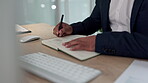 Business hands, notebook writing and planning for financial ideas, stock market strategy and budget goals at desk. Professional worker or trader with trading notes, brainstorming or tips in journal
