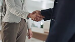 Handshake, welcome and meeting with business people in office for teamwork, thank you or agreement. Partnership, deal or support with closeup of employees shaking hands for contract and collaboration