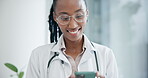Woman, doctor and smile with phone for typing in hospital, online contact and reading healthcare notification. Telehealth african medical surgeon and chat on mobile app for info on digital network 