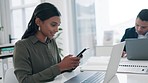 Phone, laptop and a woman employee in the office boardroom for communication or planning. Computer, technology and networking with a young business person reading text message information on a mobile