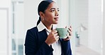 Business woman, coffee and window with thinking, vision and memory with ideas, start morning and drink in office. Entrepreneur, decision and remember with tea cup, matcha or espresso in workplace