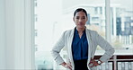 Face, mission and a confident business woman in the office with an ambition for growth or success. Portrait, corporate and a serious young employee hands on hips in her professional workplace