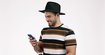 Phone, message and man laugh in studio with coffee for social media, chat or post on white background. Smartphone, app and male model with tea and laughing at funny joke, text or online communication