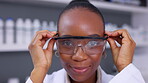 Face, woman and scientist with glasses in laboratory for safety, chemistry innovation and investigation. Portrait of happy african science worker with goggles for ppe, biotechnology and physics test 