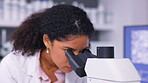 Microscope, research and scientist doing analysis in a lab to test chemistry experiment or bacteria exam for biology. Medical, sample and young professional technician discover medicine cure