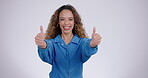 Thumbs up, face and woman in studio with smile for winning, achievement and success on white background. Portrait of happy model, ok emoji and like sign for feedback, review and voting yes in support