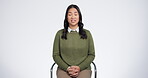 Interview, show and woman in a chair in studio for conversation on TV or online broadcast isolated in white background. Smile, happy and talking person or journalist share news, story or press speech