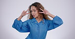 Woman, face and peace hand in studio on gray background with smile, laugh and v gesture for confident and good vibes. Portrait, emoji and excited with happy young person indoor for comic and fashion