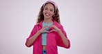 Face, heart and hands of woman in studio for care, kindness and charity donation on white background. Portrait of happy model with finger shape, hope and icon of love, thank you and emoji of support