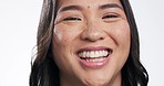 Face, funny and Asian woman with a smile, humor and girl laughing on white studio background. Portrait, model and Japanese person with happiness, freedom and joke with self love, laughter or carefree