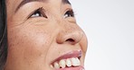 Thinking, happy and Asian woman in face closeup in studio isolated on a white background mockup space. Idea, vision and female person smile to remember memory, planning and daydreaming in peace