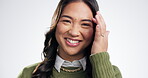 Face, smile and laughing with a cute asian woman in studio on a white background for beauty. Portrait, happy and funny with a young gen z person closeup for comedy, confidence or humor in Japan