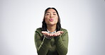 Face, air kiss and Asian woman happy in studio isolated on white background mockup space. Portrait, love and person blowing for romance, kindness and hand emoji to flirt, smile and care on valentines