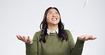 Winner, money and excited Asian woman on a white background with success, lottery and victory. Studio, surprise and isolated person with cash confetti for winning competition, bonus and giveaway