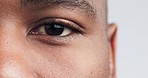Eyes, closeup and man in studio for vision, optometry and contact lens prescription.  Eye test, zoom and guy face optics, exam or ophthalmology appointment for glaucoma, cataract or sight assessment