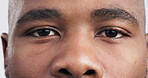 Eye, zoom and iris with portrait of black man in studio for vision, healthcare, optometry or retina. Human, contact lens and exam with closeup of person on white background for medical and eyeball