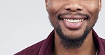 Happy, mouth and closeup of a man with smile in a studio with dental care, hygiene or wellness. Happiness, teeth and zoom of young African male model with oral health by white background with mockup.