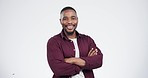 Face, smile and black man with arms crossed in studio for confidence, pride and power on grey background. Happy, portrait and African male model proud, young and positive attitude or mindset pose