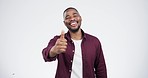 Smile, face and black man with thumbs up in studio for thank you, support or review on white background. Happy, portrait and African male winner with hand, vote and trust emoji for feedback success