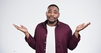 Shrug, hands and face of black man confused in studio with choice, why and dont know gesture on white background. Questions, portrait and African model with palm emoji for thinking, ask or decision