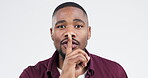 Quiet, secret and face of black man with a gesture on a white background for gossip or rumor. Noise, portrait and young African person with hand on lips or mouth for privacy or problem on a backdrop