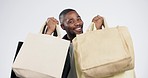 Man, studio and eco friendly shopping bags with excited smile, face or discount by white background. African guy, customer or happy for deal, sale or saving with sustainable fabric, care or recycling
