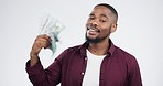 Money, face and black man in studio happy with cashback, reward or bingo award on white background. Cash, portrait and African winner smile for casino, bonus or poker payment with financial freedom
