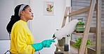 Dust cleaning, woman work and home with duster and cleaner in a living room. Bookcase shelf, female person and housekeeping brush in a lounge with furniture and maintenance for health and hygiene