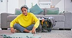 Laundry, headphones and woman fold clothes for housekeeping, cleaning and hygiene. Home, living room and person with basket of clothing, fresh washing and fabric listening to music, audio and radio