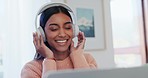 Music, headphones and laptop with relax woman at a home with podcast and dancing audio. Study, young female student and house with web radio and listening to internet sound and streaming online 