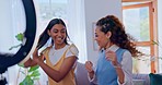 Women, social media dance challenge and live stream in living room with high five and fun laugh together. Content creator, influencer and happy girl friends in lounge recording viral video broadcast.