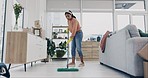 Woman, mopping or cleaning house floor for hygiene, dirt or bacteria safety in housekeeping routine. Person, wipe or equipment for ground dust control, disinfection or germs protection in living room