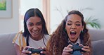 Women friends, couch and competition on video game, relax and esports challenge in home living room. Girl, gaming and excited people on sofa, lounge and contest with fist, winner and celebration