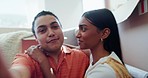 Happy couple on floor of new house with boxes, live stream and future together, investment and mortgage. Social media broadcast, man and woman relax in living room recording video call and moving home