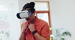 Virtual reality, man and boxing video games in home for multimedia experience, user interface and metaverse. Guy, punching and VR glasses in lounge with ui technology, sports gaming and play fighting