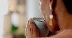 Coffee, relax and morning with a woman closeup in her home to drink a fresh beverage in the living room. Back, hand and tea with a person taking a break in their house for peace, quiet or calm