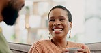 Coffee, happy and conversation with black couple on sofa for communication, relax and love. Tea, smile and gossip with man and woman talking in living room at home for  happiness, bonding and break