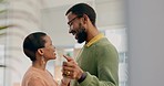 African couple, dancing and smile in home, love and bonding with care, marriage anniversary or funny memory. Black woman, man and happy dancer with romance, holding hands and moving together in house