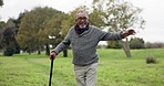 Dance, happy and a man with a cane in nature for comedy, fun and freedom in retirement. Face portrait, walking and a senior person with a stick in a park or garden for a carefree weekend or vacation